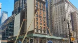 Macy's iconic red bag comes down in Herald Square, revealing long-hidden corner building
